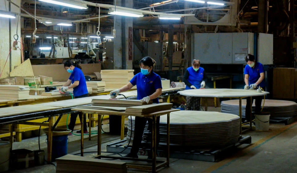 A group of people working in a factory